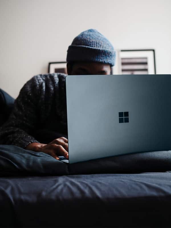 Man working on Microsoft Surface laptop