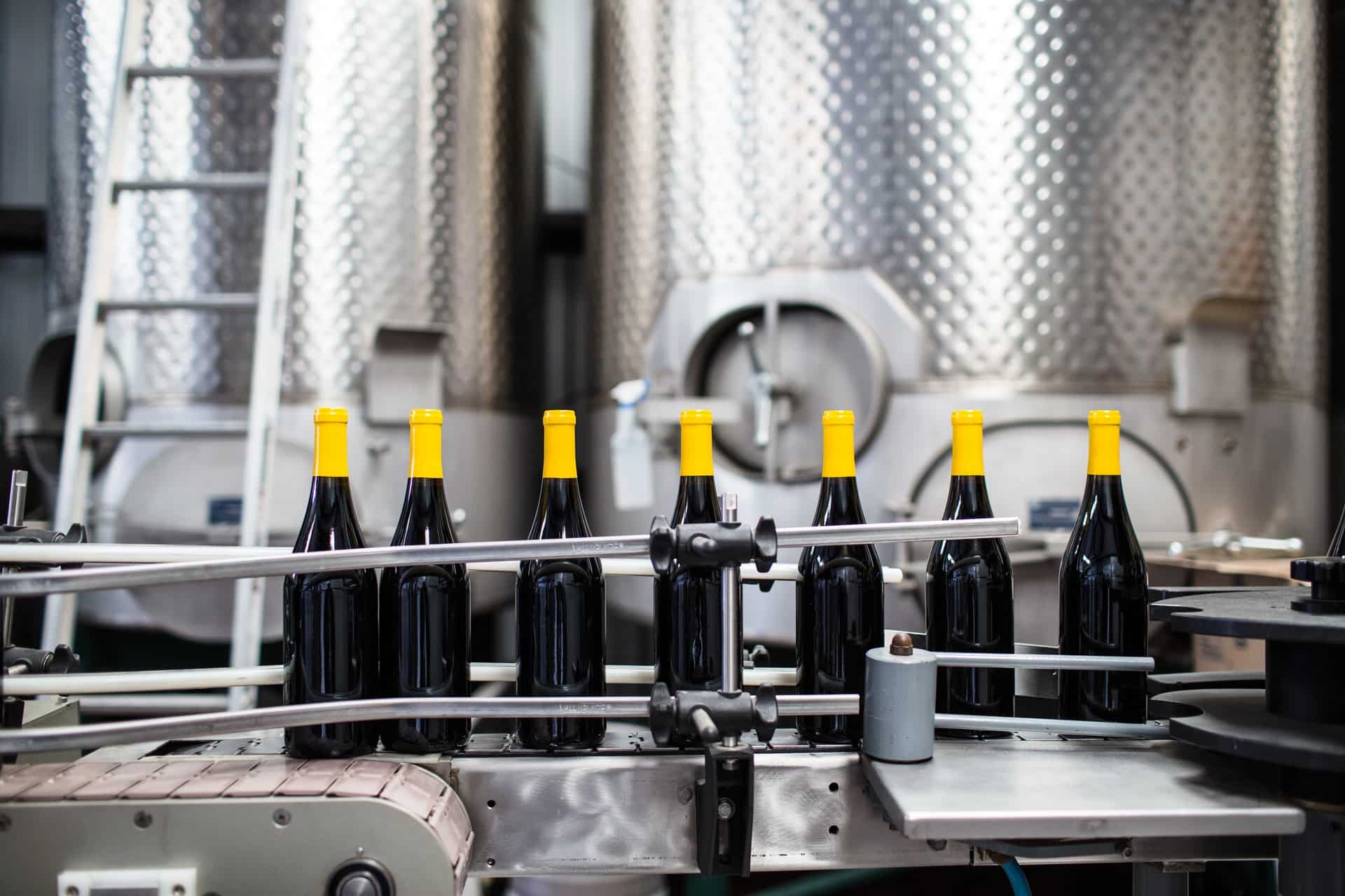 Wine bottles on manufacturing assembly using Microsoft manufacturing solutions, Dynamics 365 SCM