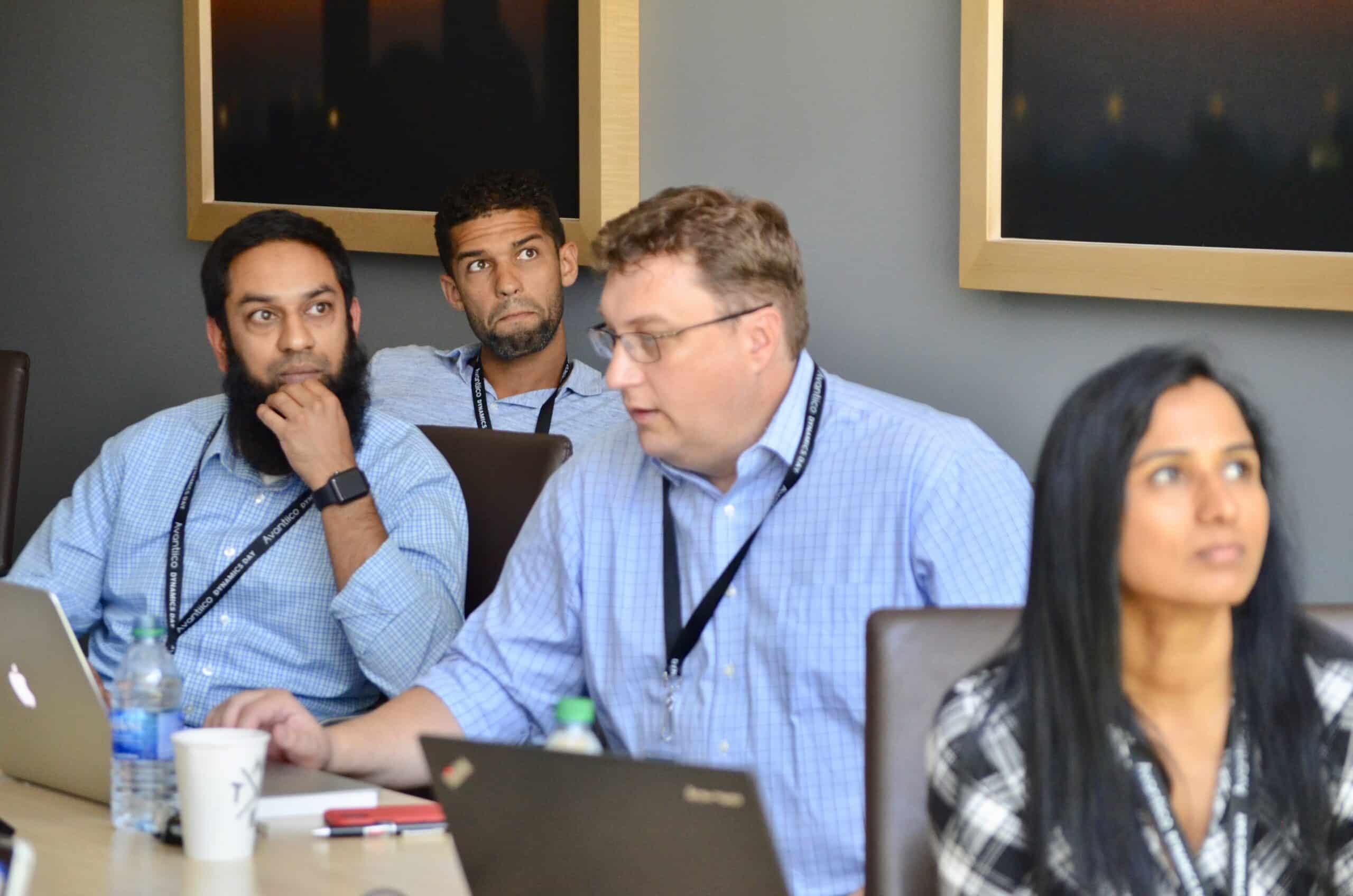 Image of 4 business professionals at an industry conference.